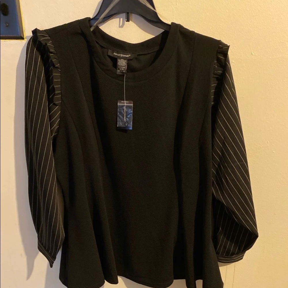 Women’s top. Peplum fit with white pinstripes.